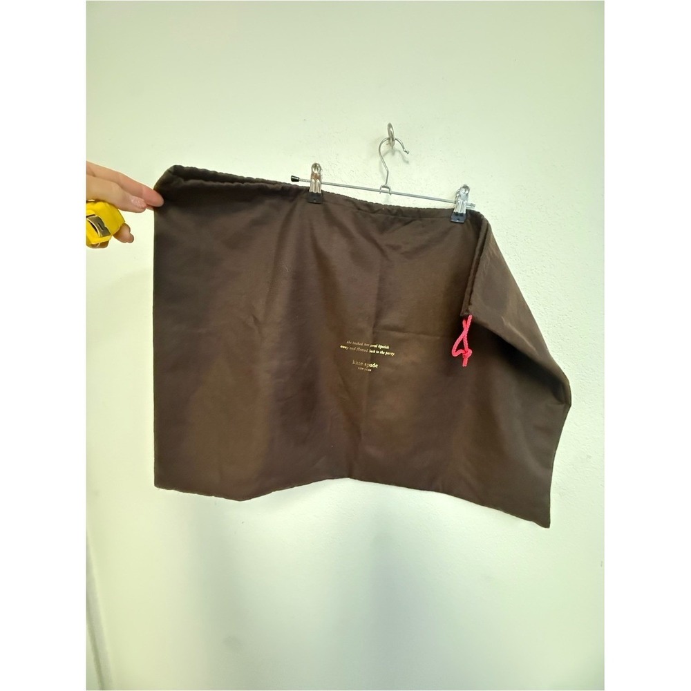 kate spade brown pouch with gold logo‎ and yellow text